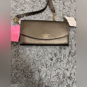 kate spade black pebbled leather crossbody wallet with gold chain. New with Tags